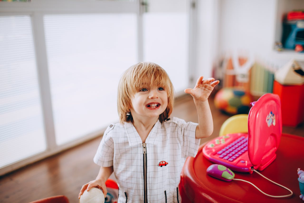 Happy young child engaged in play-based pediatric therapy in Vero Beach, Florida