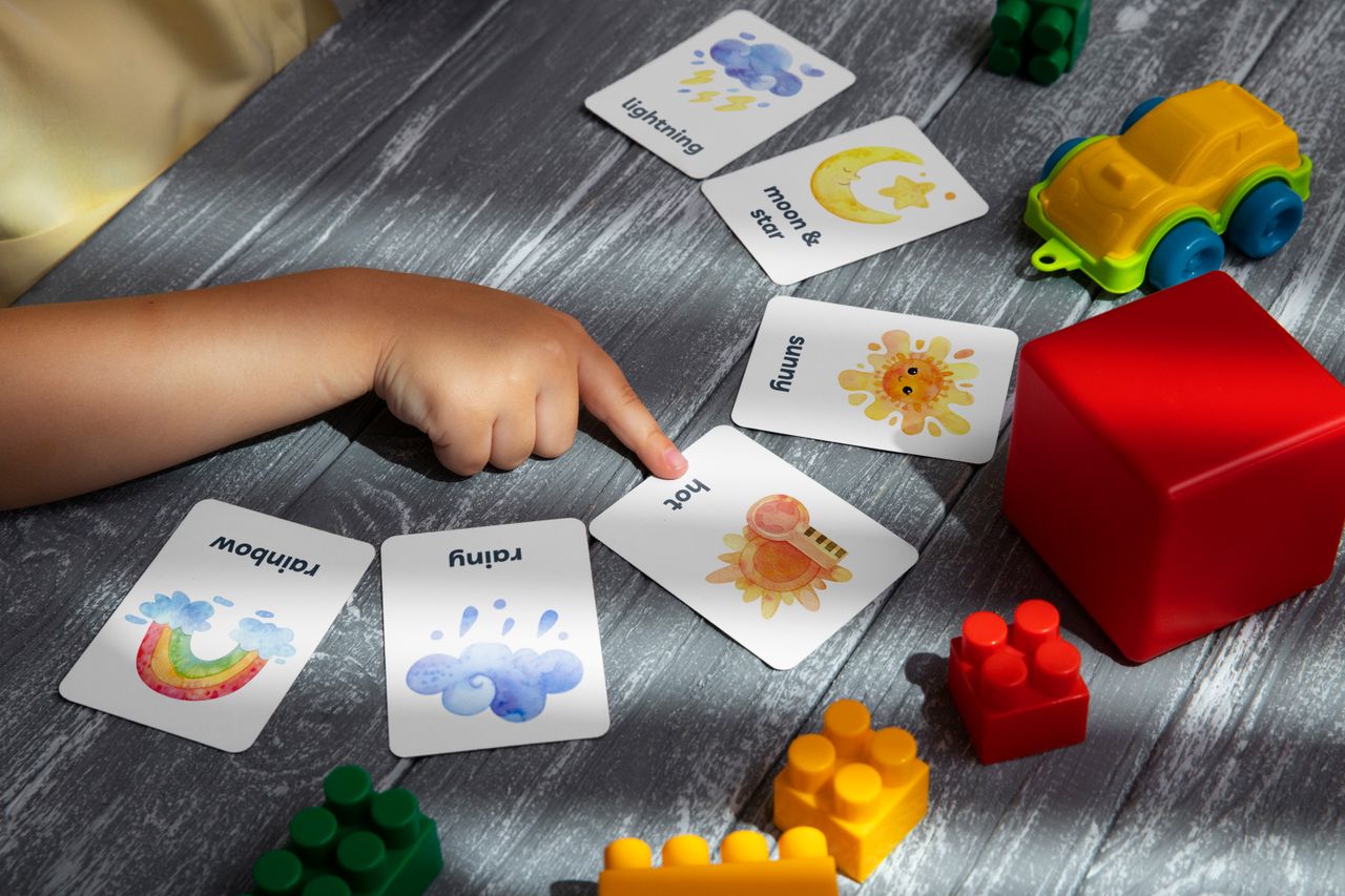 Therapist working calmly with a young child at a play table